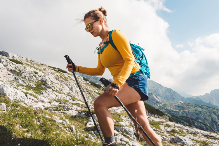 Woman+Hiking+Mountain+Trail+with+Poles+Injury-Free+Outdoors